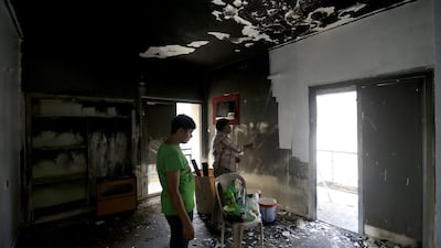 Repairs begin on the damaged apartments.