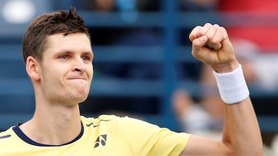 Hubert Hurkacz celebrates after winning his second round match against Kei Nishikori in Dubai. EPA