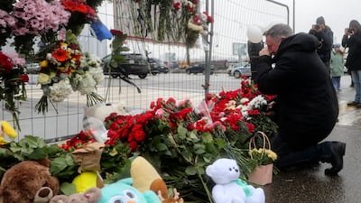 A man mourns outside the concert venue. EPA