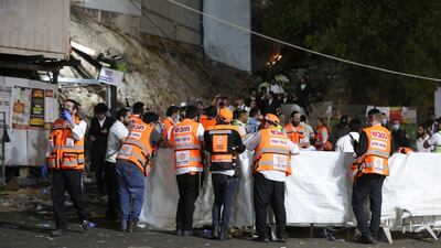 Emergency workers gather at the scene after dozens of people were killed and others injured at the Lag BaOmer festival at Mount Meron, Israel. AFP