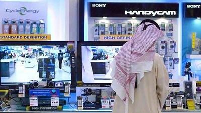 A man checks out electronics gadgets at Jumbo Electronics store in Mall of the Emirates. ( Jaime Puebla - The National Newspaper )