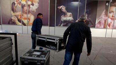 Workers prepare for the launch party of Esentai Mall in Almaty.