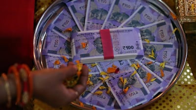 New 100 Indian rupee notes. The currency has lost value amid government action over troubled states. Reuters