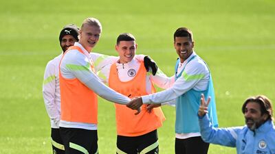 Erling Haaland, Riyad Mahrez, Phil Foden and Joao Cancelo train on Monday. AFP
