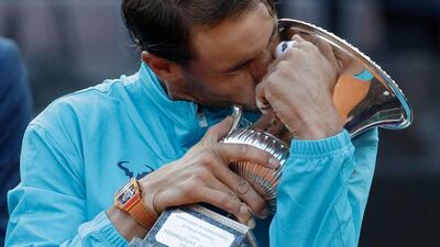 Rafael Nadal kisses his trophy after winning against Novak Djokovic at the Italian Open tennis tournament in Rome. AP Photo