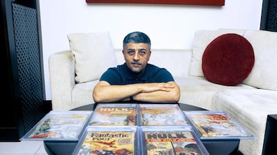 Peter Georgiou with his rare collection of Comics from Fantastic Four to the Hulk. Jeffrey E Biteng / The National