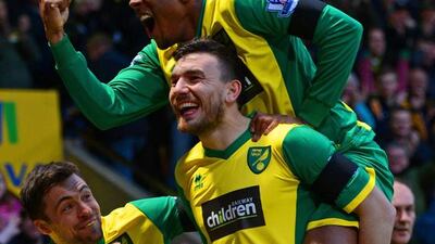 Robert Snodgrass of Norwich City, centre, celebrates scoring the opening goal with teammates the Canaries 1-0 win over Tottenham Hotspur at Carrow Road on February 23, 2014. Michael Regan / Getty Images