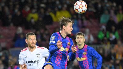 Barcelona's Dutch midfielder Frenkie De Jong heads the ball. AFP