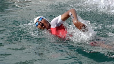 Jonah Hambleton begins the swimming leg of his gruelling race. Victor Besa / The National