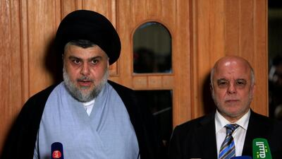 Iraqi Shiite cleric Moqtada Al Sadr and Iraqi caretaker prime minister Haider Al Abadi announce an alliance between their political blocs at a press conference in Najaf on June 23, 2018. Alaa Al Marjani / Reuters