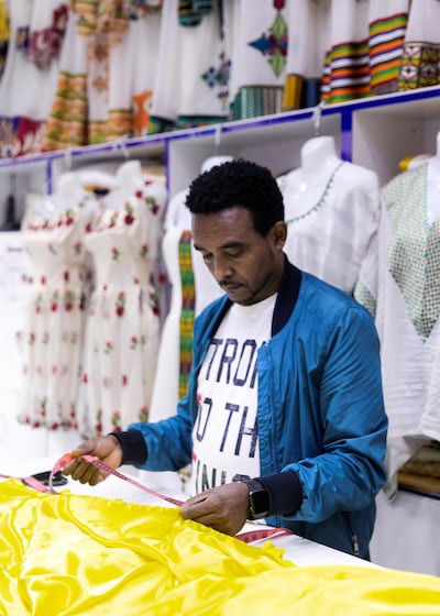 Mulugeta owner of Mulugeta Belay Fashion & Ladies Tailoring in Deira. Reem Mohammed / The National