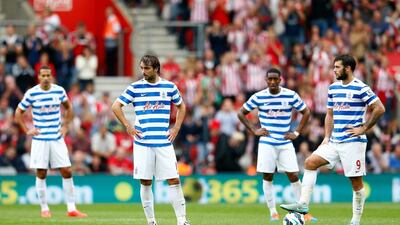 Niko Kranjcar, second left, and Charlie Austin, right, look on before kicking off following Southampton's second goal in QPR's Premier League loss on Saturday. Julian Finney / Getty Images