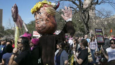 An effigy of president Donald Trump is carried through the Capitol grounds during the women’s march in Austin, Texas. Ralph Barrera / Austin American-Statesman via AP