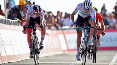 Tadej Pogacar, left, and Alexey Lutsenko on the final sprint of Stage 5 at City Walk in Dubai on Thursday. The tour was halted hours later when two Italian cyclists tested positive for coronavirus. Bettini Photo