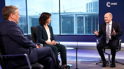 German election candidates, left to right, Armin Laschet, Annalena Baerbock and Olaf Scholz, during a televised debate in Berlin. Reuters