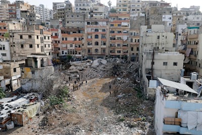 Rescuers work at the site of the collapsed residential building in Tripoli, Lebanon. EPA