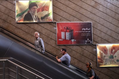 A poster showing Iran's former supreme leader Ayatollah Ali Khamenei on the wall of a metro station in Tehran. AFP