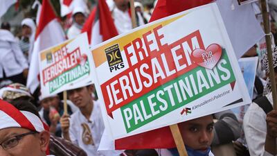 Protesters photographed in Jakarta, Indonesia on Sunday, where hundreds of demonstrators took to the streets in sympathy for Palestinians following Donald Trump's aggressive move to recognise Jerusalem as Israel's capital. Dita Alangkara / AFP