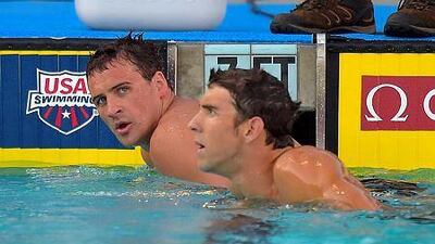 Ryan Lockte, left, and Michael Phelps look on after the men's 200-meter individual medley final at the U.S. nationals of swimming, Sunday, Aug. 10, 2014, in Irvine, Calif. Lockte won and Phelps took second in the event. (AP Photo/Mark J. Terrill)