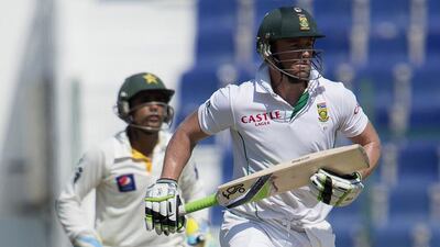 AB de Villiers, right, had innings of 19 and 90 with the bat in the first Test against Pakistan. AFP Photo