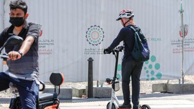 E-scooter riders along Al Falah Street in central Abu Dhabi on a Friday afternoon.