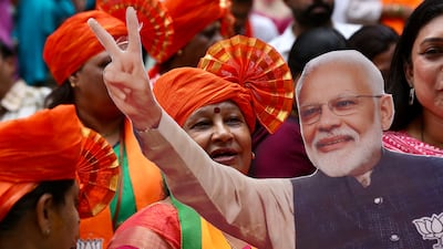 Bharatiya Janata Party supporters celebrate at BJP headquarters in Bengaluru, southern Karnataka state. EPA