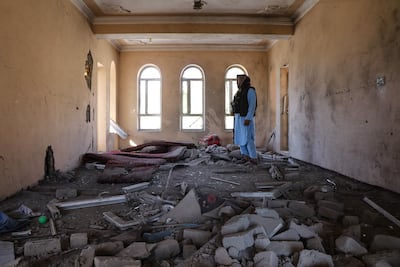 An Afghan resident looks at the remains of a building damaged in a Pakistani air strike at a village in Paktia province. AFP