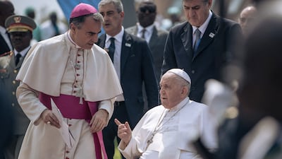 Pope Francis is escorted to the plane when leaving Kinshasa in the Democratic Republic of Congo. AFP