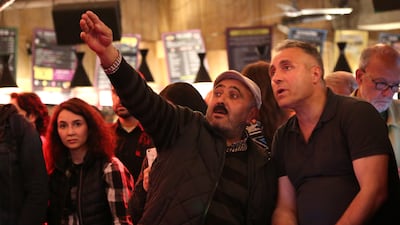 Turkish expats watch the election results come in on a big screen in Berlin. Getty