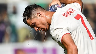 Juventus' Portuguese forward Cristiano Ronaldo pours water on his neck to refresh himself. AFP