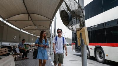 Some of the electric fans in Sharjah’s Al Jubeil bus station are not working, making passengers overheat. Victor Besa for The National