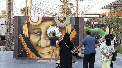 People taking photos with 3D art work by Shawn McCann at the Dubai Canvas held at La Mer in Dubai. Pawan Singh / The National