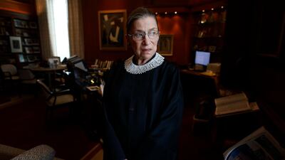 Associate Justice Ruth Bader Ginsburg poses for a photo in her chambers at the Supreme Court in Washington, before an interview with The Associated Press. Ginsburg, developed a cult-like following over her more than 27 years on the bench, especially among young women who appreciated her lifelong, fierce defense of women's rights. She died Sept. 18, 2020. AP Photo