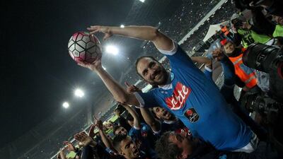 Napoli's Gonzalo Higuain celebrates at the end of their Italian Serie A football match against Frosinone Calcio on May 14 2016 at the San Paolo stadium in Naples. Napoli won the match 4-0. AFP / CARLO HERMANN