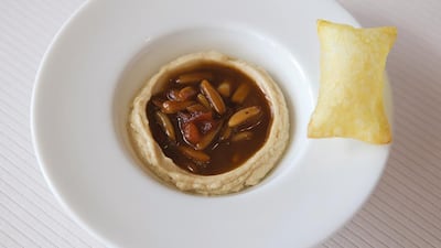 Hummus of duck liver with pine nuts, bread souffle. Hommage a Dubai dish at Reflets par Pierre Gagnaire InterContinental Dubai Festival City. ( Jaime Puebla / The National)