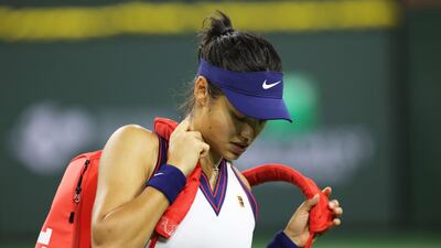 Emma Raducanu grabs her racket bag ready to walk off court after her straight sets defeat against Aliaksandra Sasnovich in Indian Wells, California. Getty