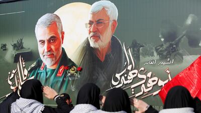 Iraqi women gather at the scene where Iran's Quds Force top commander Qassem Soleimani and Iraqi militia commander Abu Mahdi al-Muhandis were killed in a US airstrike at Baghdad airport. REUTERS