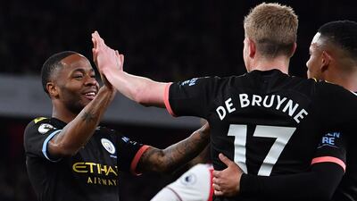 Raheem Sterling, left, celebrates with Kevin De Bruyne at the Emirates Stadium in London. AFP
