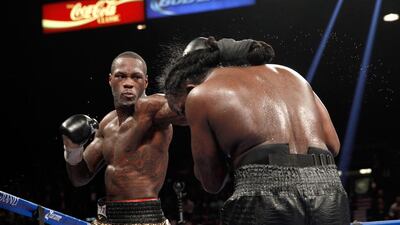 WBC heavyweight champion Deontay Wilder, left, connects with Bermane Stiverne during their bout in Las Vegas last month. Steve Marcus / AFP