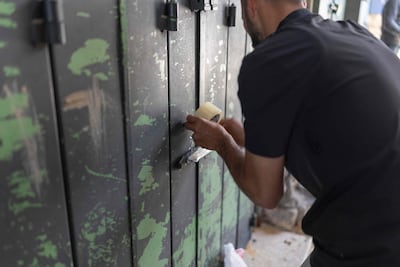 A Palestinian man closes his shop in the old city of Jerusalem before the parade. AFP