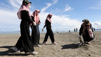Young people organise a beach cleanup in Indonesia. EPA