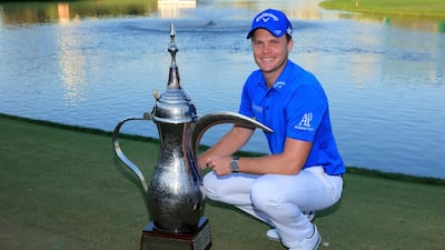 Danny Willett of England proudly holds the trophy after his one shot victory in the final round of the 2016 Omega Dubai Desert Classic on the Majlis Course at the Emirates Golf Club on February 7, 2016 in Dubai, United Arab Emirates. (Photo by David Cannon/Getty Images)