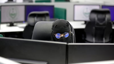 A woman fields calls at the National Centre for Security Operations in Mecca, Saudi Arabia, days before the annual Hajj pilgrimage.