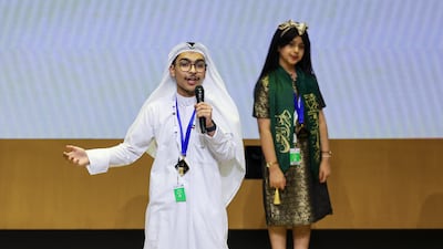 Sulaiman Al Shammari at Arab Reading Challenge, with joint winner 11-year-old Kadi bint Musfir
