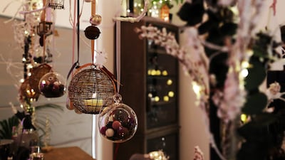 Much of the Christmas decor, including the garlands and hanging branches, are hand-made in White's home. Photo: Pawan Singh / The National