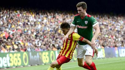 Barcelona's Munir El Haddadi, left, duels for the ball against Athletic Bilbao's Aymeric Laporte during a Spanish Primera Liga match at the Camp Nou stadium in Barcelona, Spain, on September 13, 2014. Manu Fernandez / AP Photo