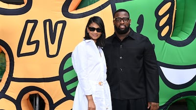 Model Chanel Iman and American footballer Davon Godchaux attend the Louis Vuitton show. Getty Images For Louis Vuitton