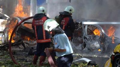 Firefighters are seen working at the site of a suspected car bomb explosion in a busy street in the Turkish capital, Ankara, Turkey. AFP Photo