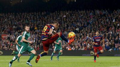 Barcelona’s Sandro Ramirez passes a ball to Luis Suarez before their equalising opener against Eibar in La Liga on Sunday. Albert Gea / Reuters