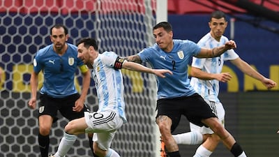 Messi and Uruguay's Jose Maria Gimenez battle for the ball. AFP